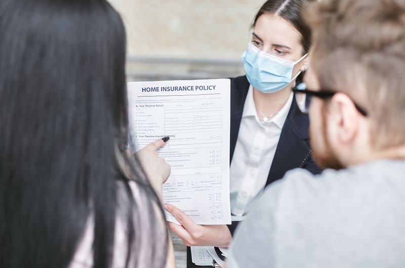 Person comparing health insurance plans side by side on laptop