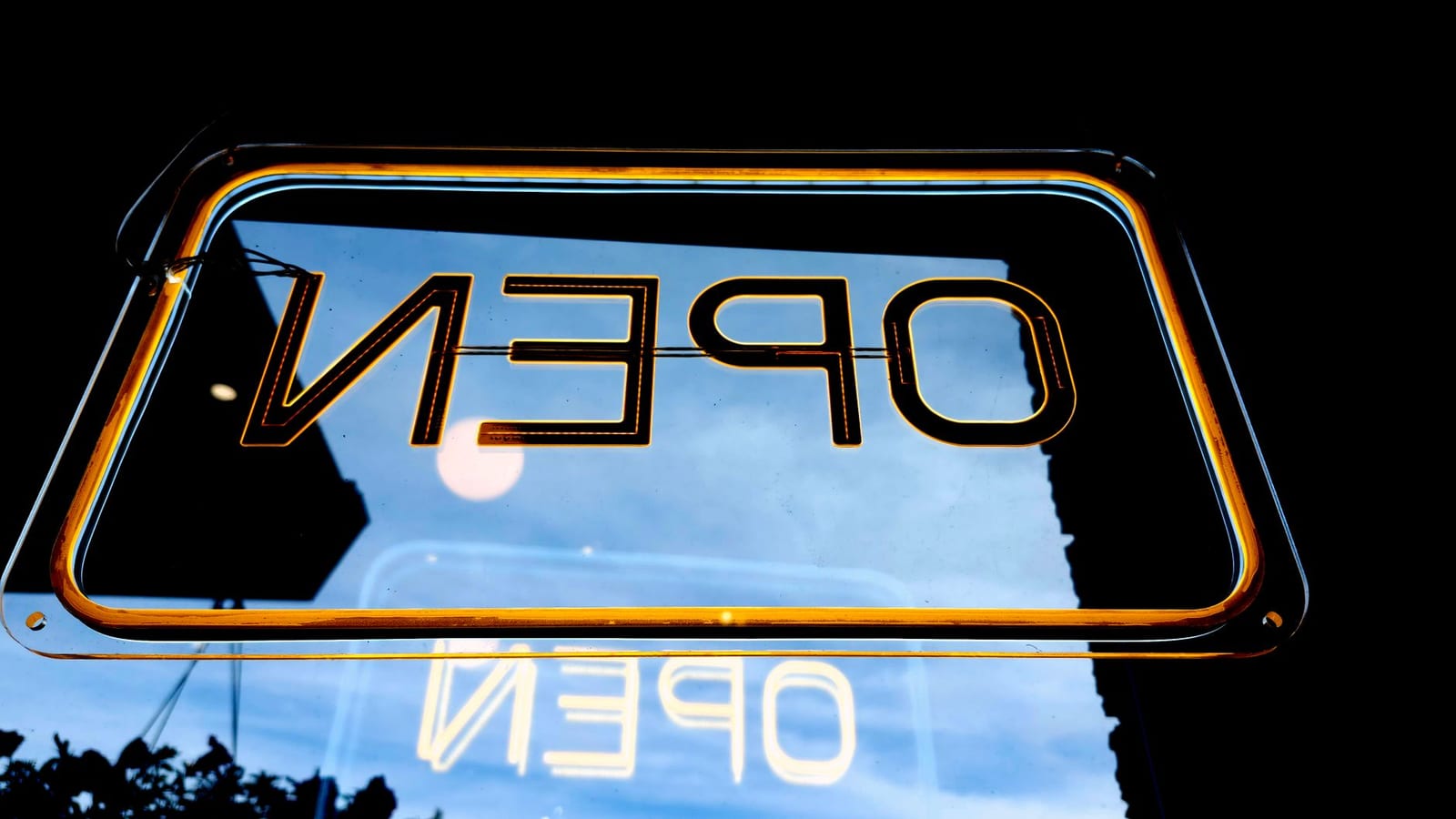 Upside-down neon 'Open' sign glowing warmly, reflecting urban night ambiance. - How to report changes to the Marketplace