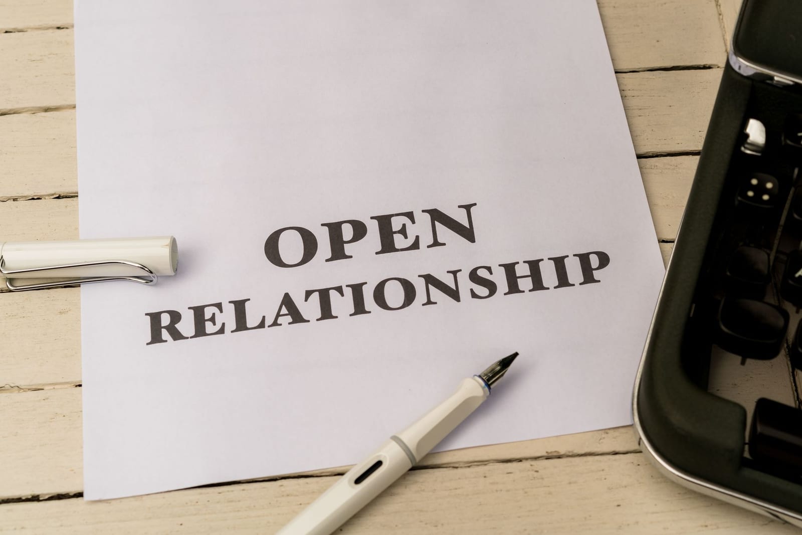 Image depicting the concept of 'Open Relationship' on paper with a pen and typewriter. - If you had a Marketplace plan with the premium tax credit