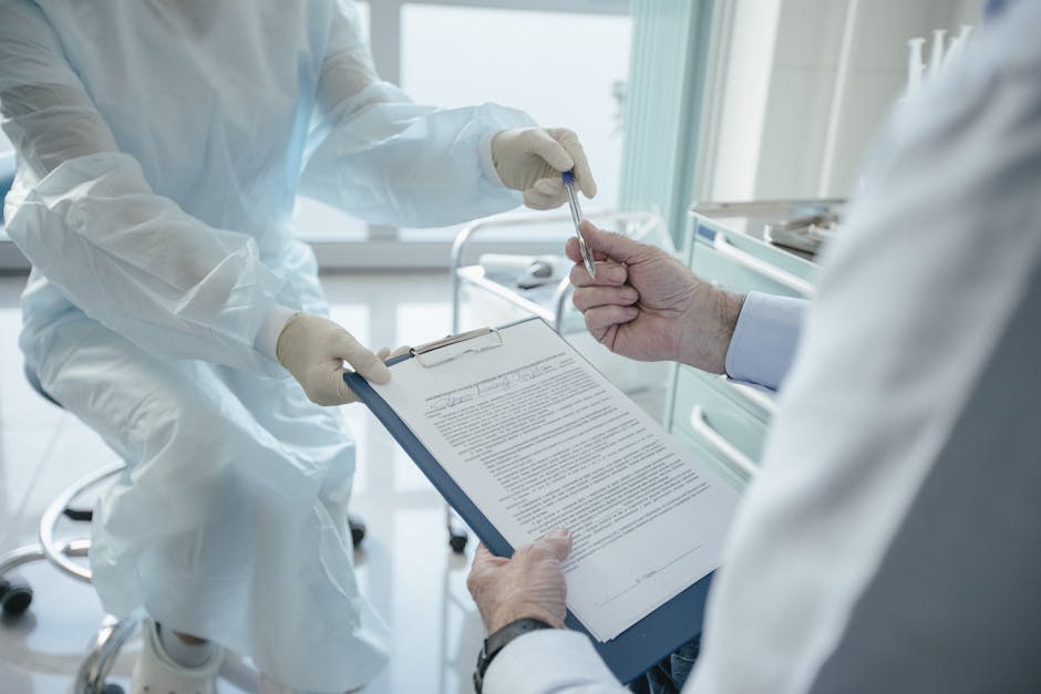 A doctor hands a clipboard to a patient for signature, highlighting medical professionalism. health insurance