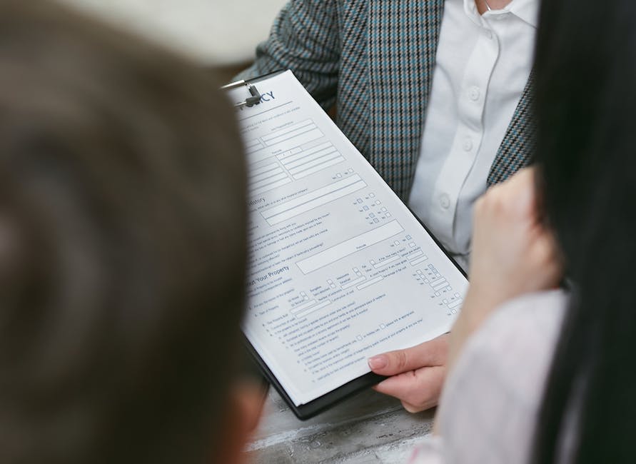 Close-up of professionals discussing a legal contract during a business meeting. health insurance
