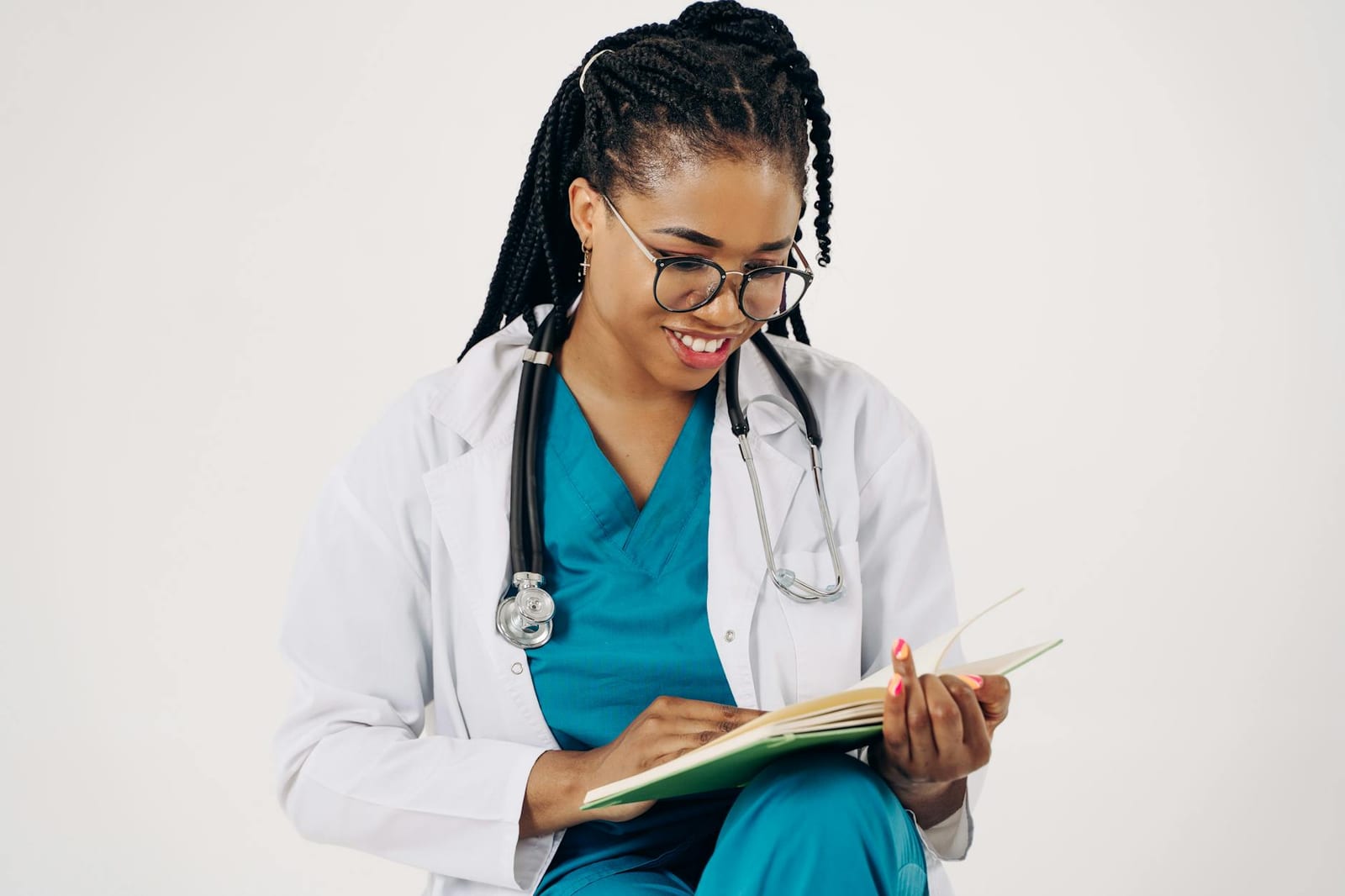 Smiling female doctor with stethoscope reading medical documents. health insurance