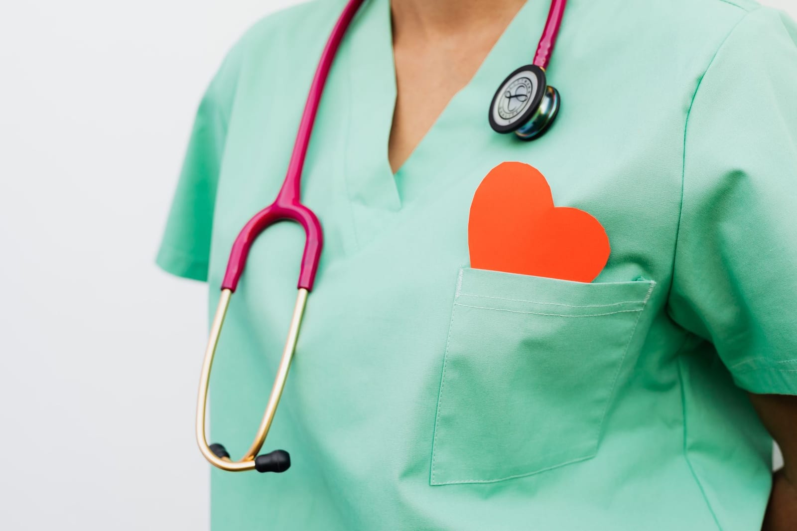 A healthcare professional with a stethoscope and red heart symbol emphasizes cardiology care. health insurance