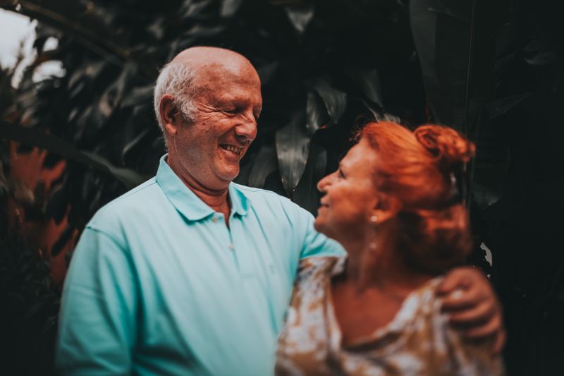 Happy senior couple enjoying Medicare coverage peace of mind outdoors